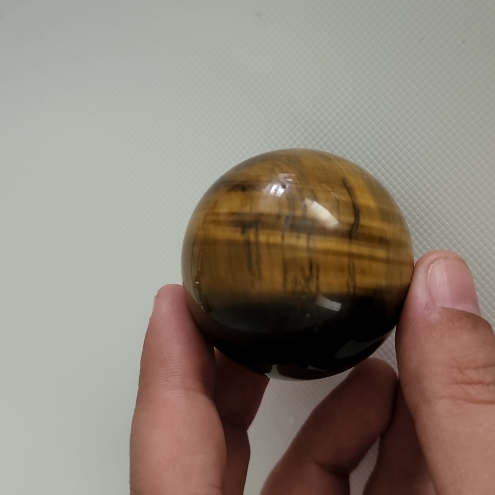 Honey tiger eye sphere